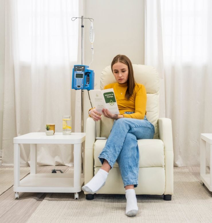 Woman receiving infusion therapy